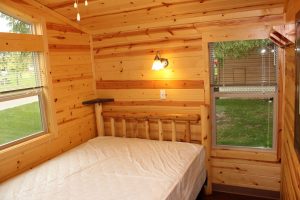 regular bed in cabin bedroom